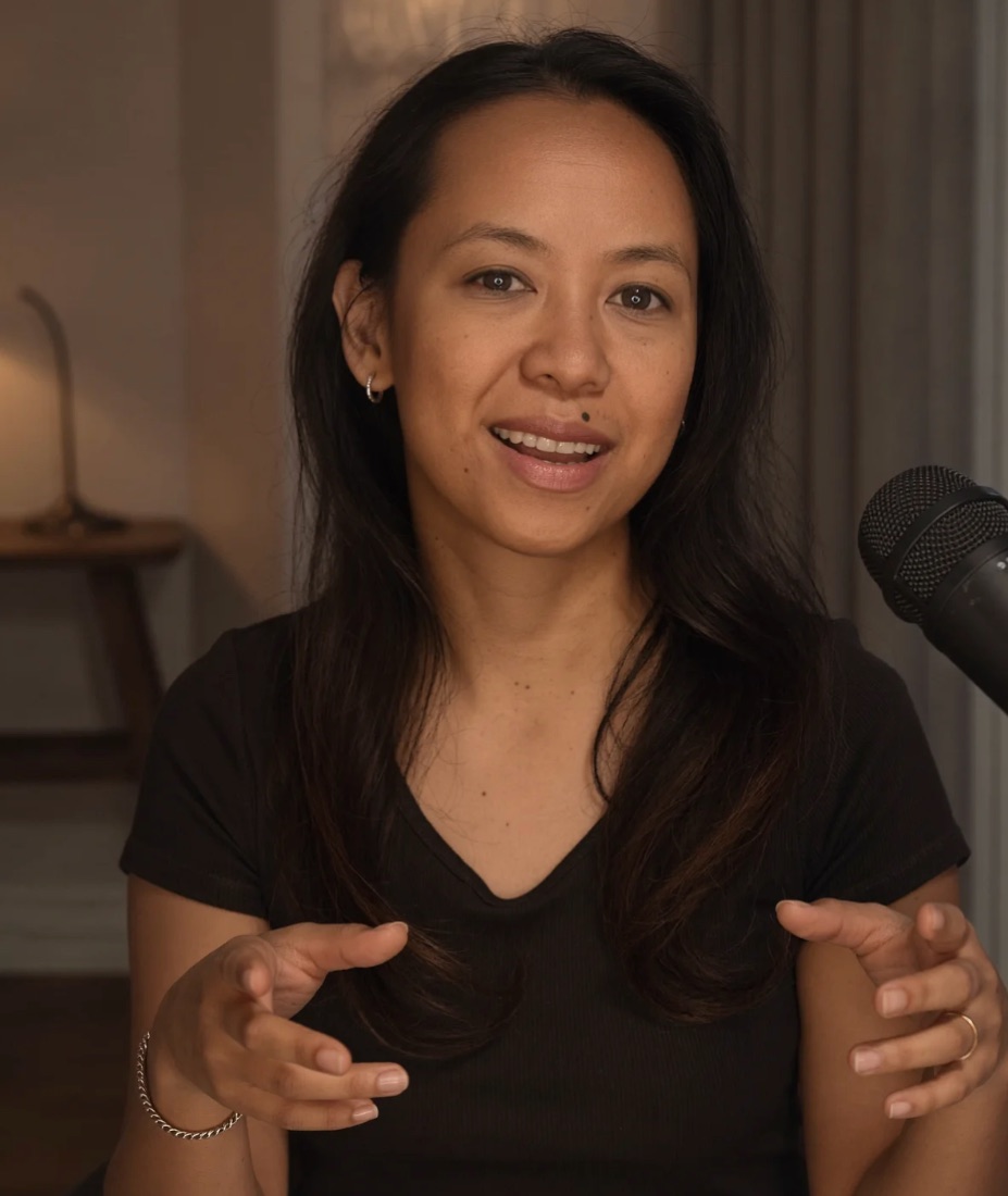 AI-generated image of a woman gesturing — the hands and fingers show the subtle distortions typical of AI